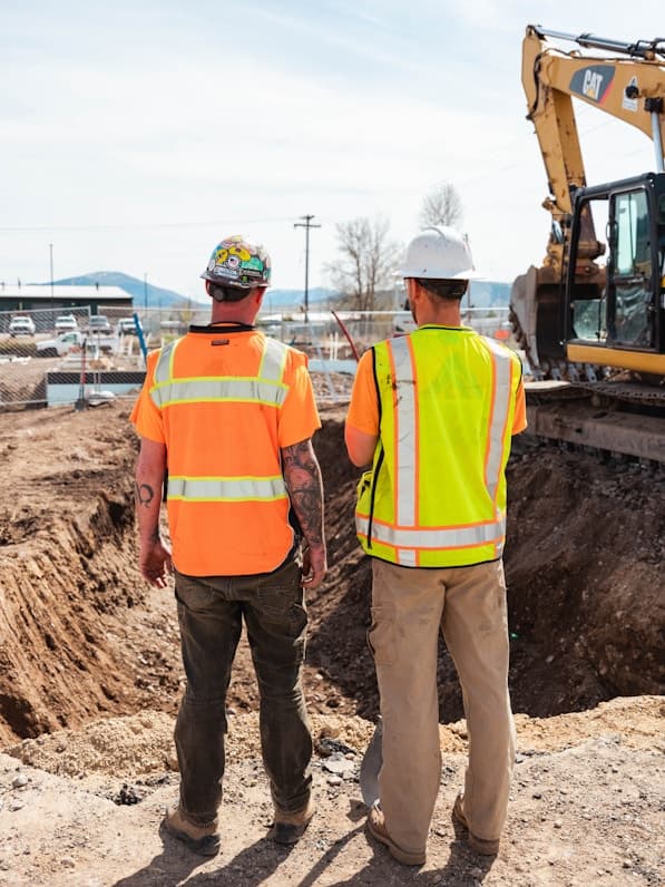 Site engineers assessing excavation ground